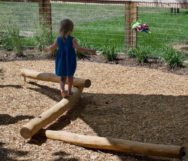 Mila Jade on balance log